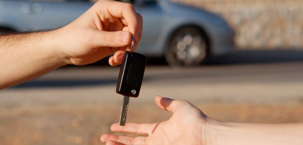 Woman Hand On Isolated Background Holding Car Key